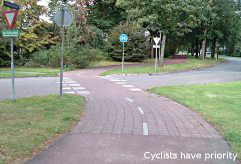 At many road junctions, cycle paths have priority